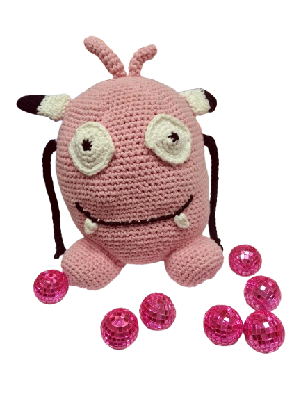 La peluche Petit dev avec des boules à facettes roses